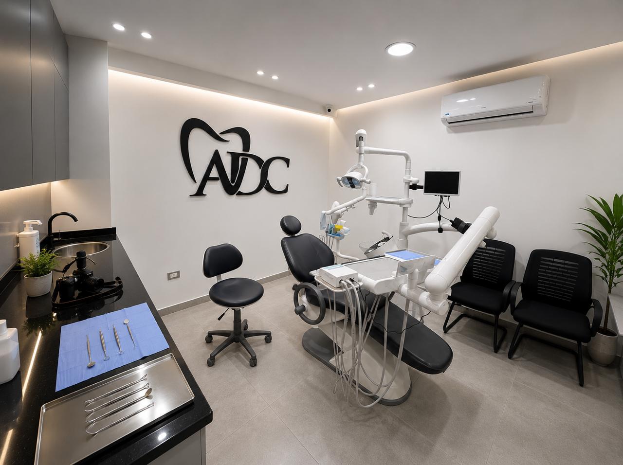 Modern treatment room at Abuelroos Dental Clinic with dental chair and equipment